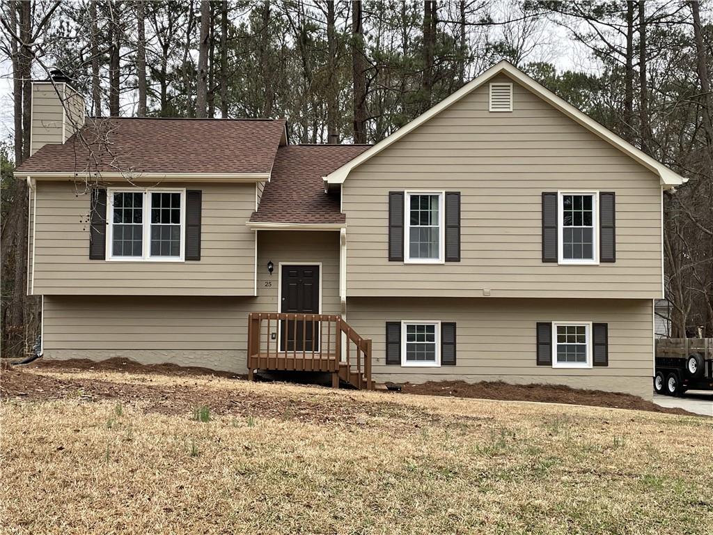 25 Cherry Cove Dallas, GA 30157 - Photo 1 of 1 a front view of a house with a yard