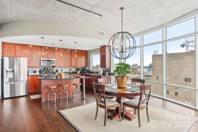 a kitchen with a table and chairs in it