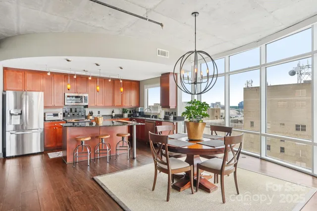 a kitchen with a table and chairs in it