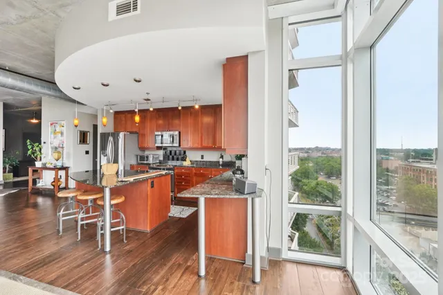 a kitchen with granite countertop a sink and a window