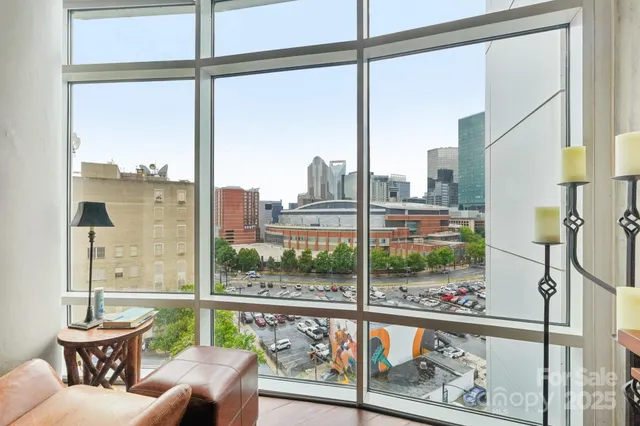 a bedroom with furniture and a potted plant