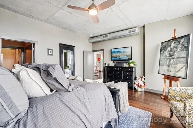 a bed room with a bed a couch and dresser