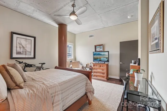 a terrace with a dining table and chairs
