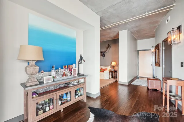 a living room with lots of furniture and a large window