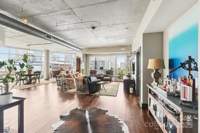 a living room with furniture or couch and a wooden floor