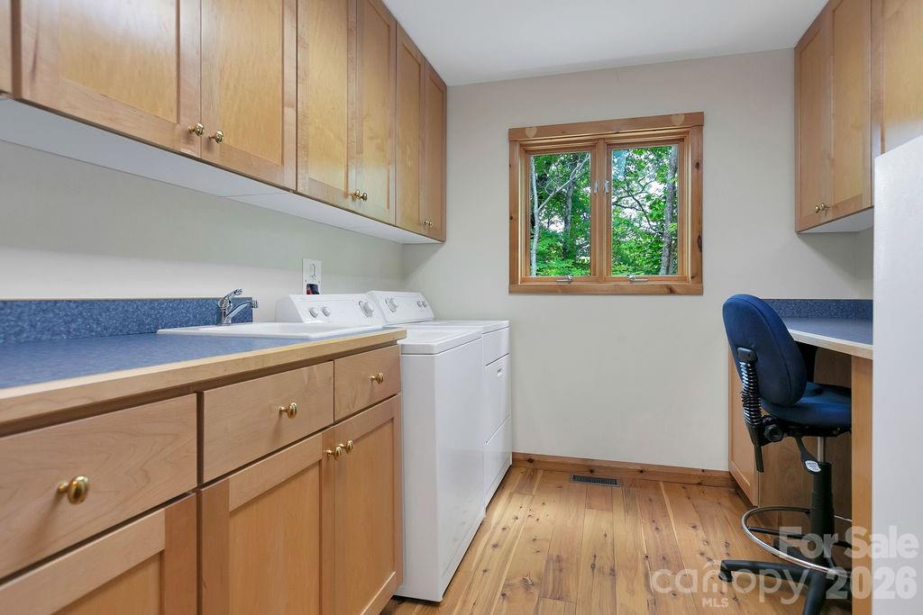 40 Walnut Ridge Road Brevard, NC 28712 - Photo 25 of 47 a utility room with wooden floor washer and dryer