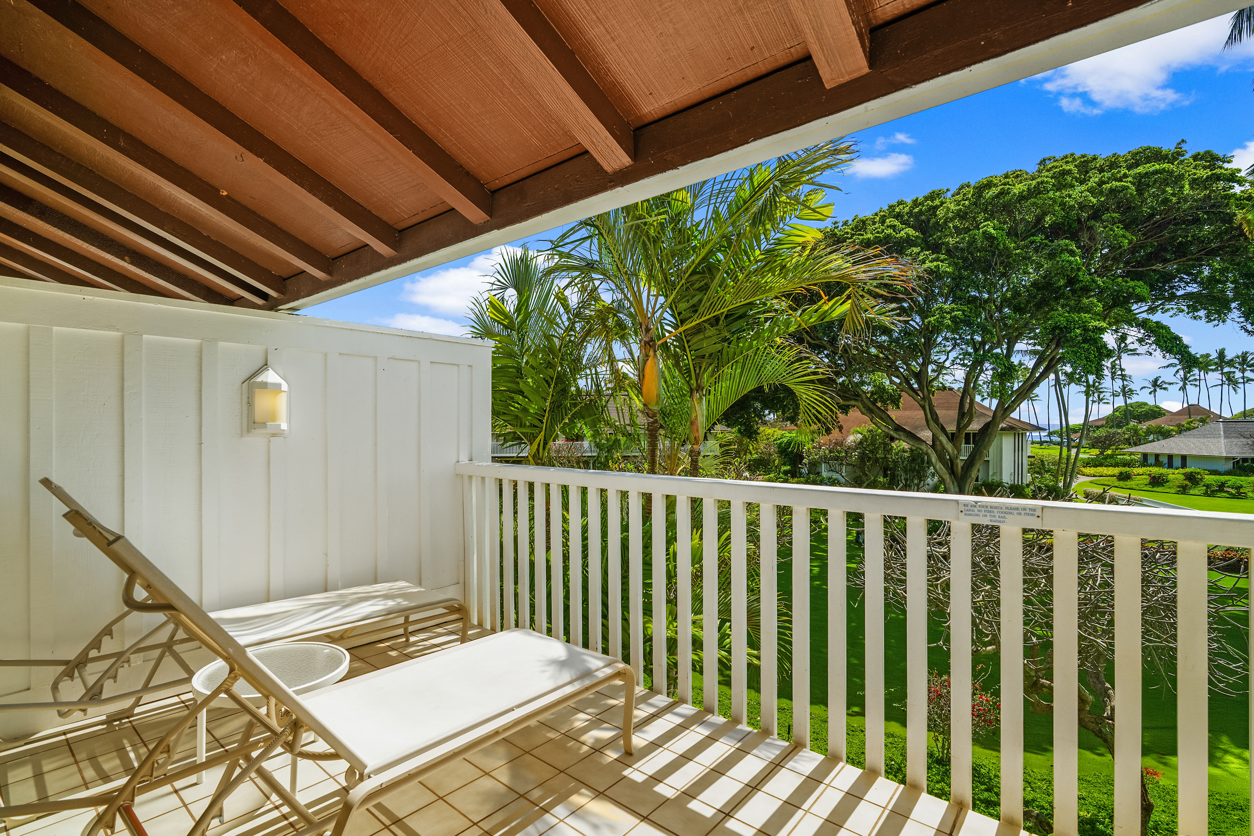 2253 Poipu Road, Unit 67 Koloa, HI 96756 - Photo 15 of 24 a view of a backyard with wooden floor