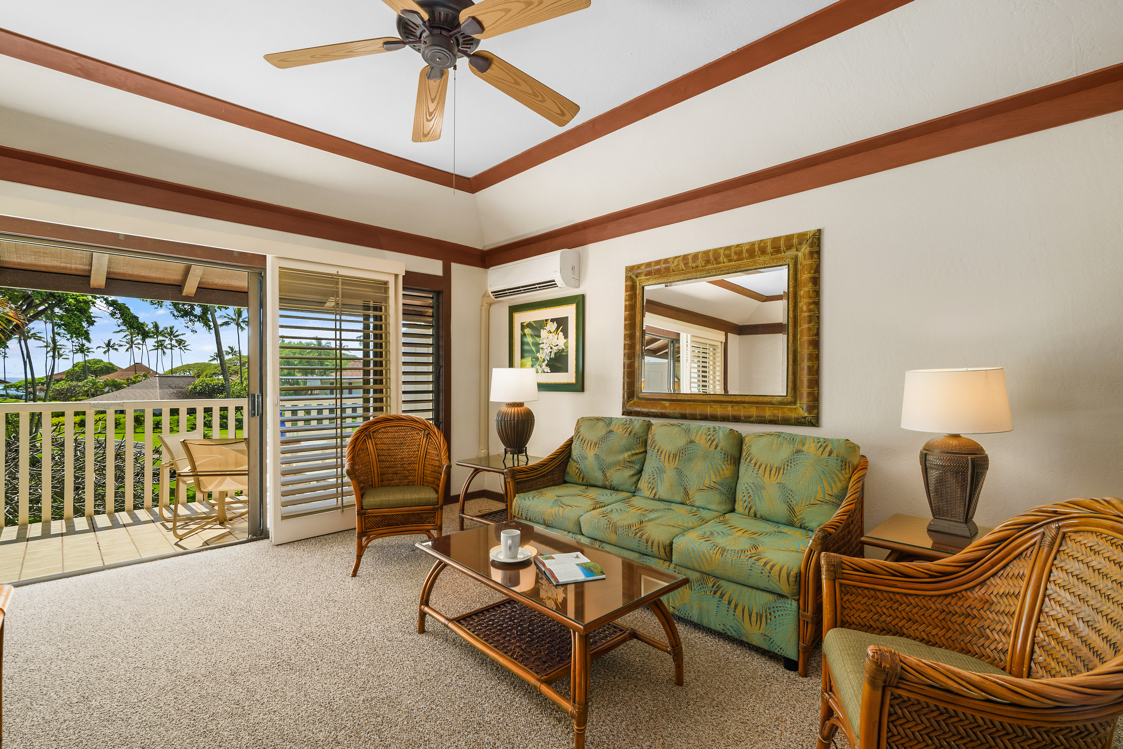 2253 Poipu Road, Unit 67 Koloa, HI 96756 - Photo 3 of 24 a living room with furniture and a floor to ceiling window
