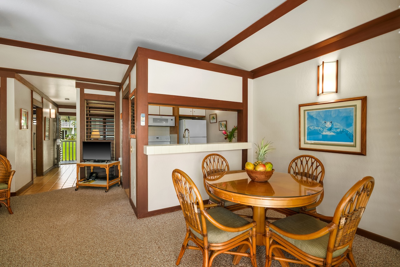2253 Poipu Road, Unit 67 Koloa, HI 96756 - Photo 8 of 24 a dining room with furniture and window