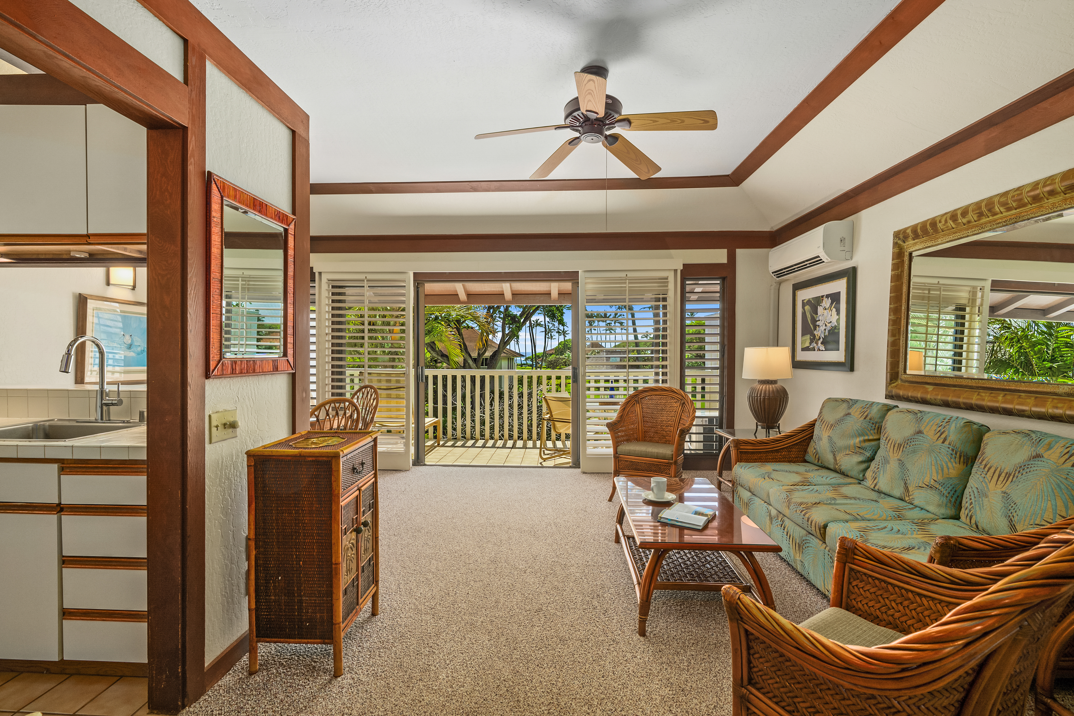 2253 Poipu Road, Unit 67 Koloa, HI 96756 - Photo 10 of 24 a living room with furniture and a floor to ceiling window
