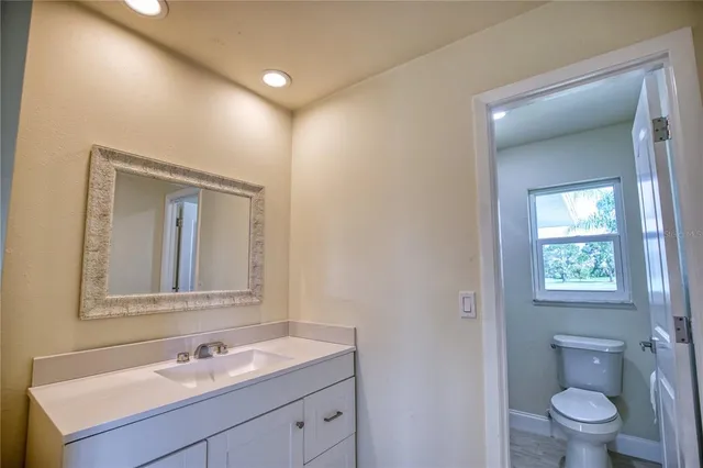 a bathroom with a glass door shower
