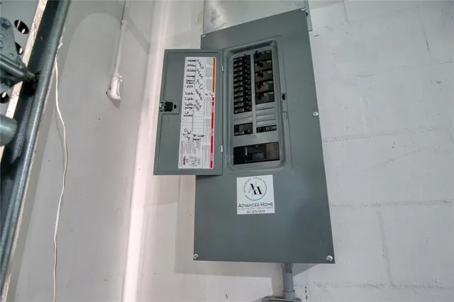 a view of an empty room with a floor to ceiling window and an outdoor view