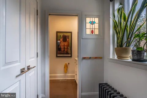 a bathroom with a sink and a window
