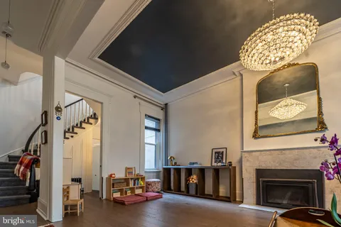 a view of a livingroom with furniture and a fireplace