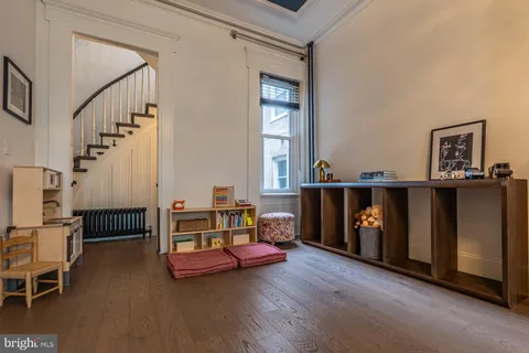 a bedroom with furniture and a window