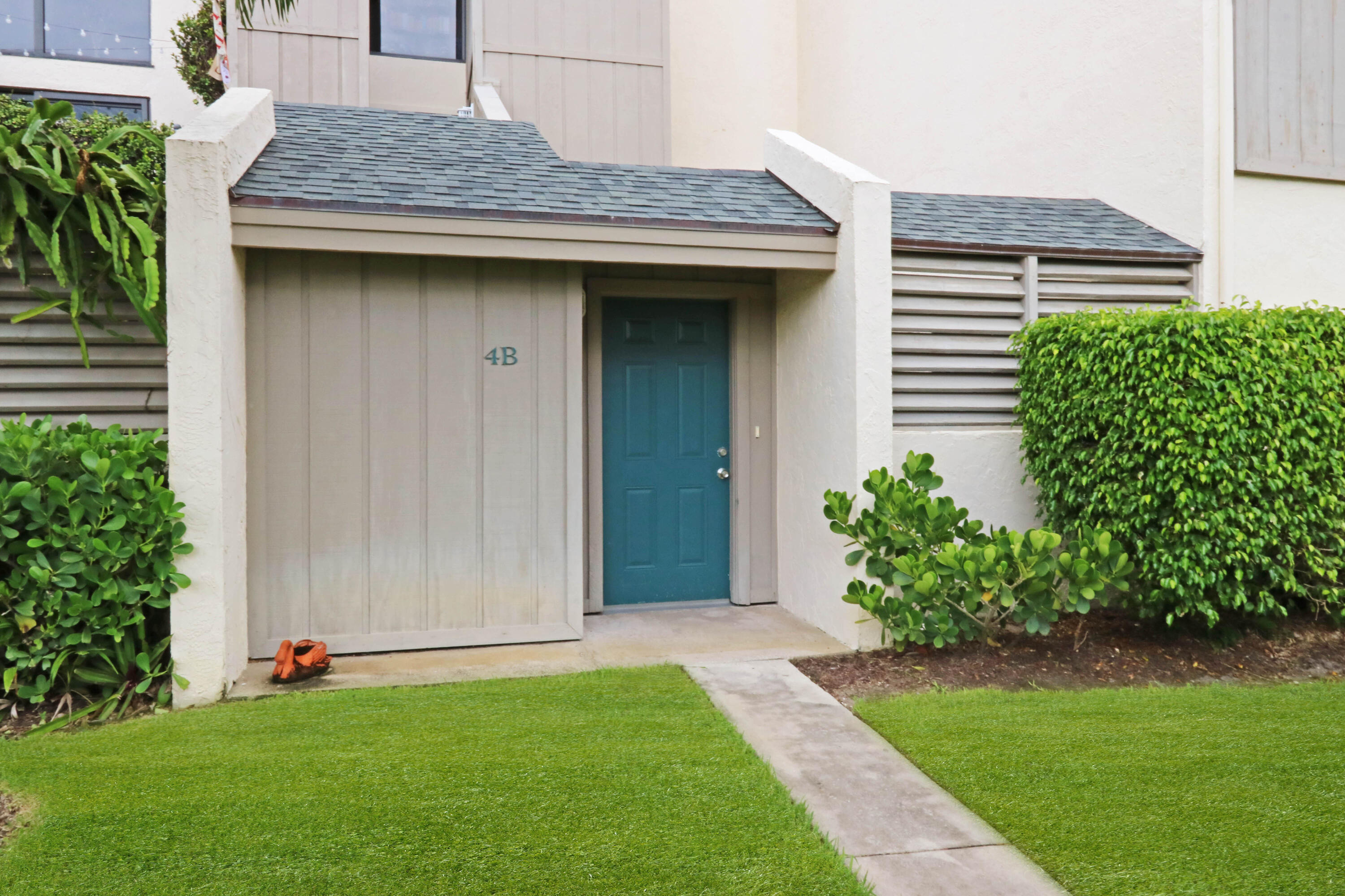 1605 Highway 1, Unit 4B Jupiter, FL 33477 - Photo 3 of 26 a house with garden in front of it