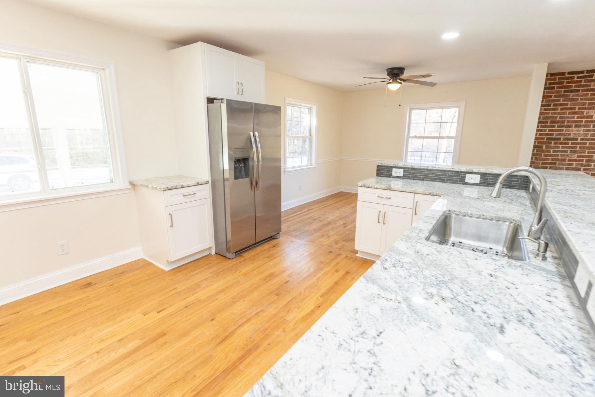 49151 Wynne Road Ridge, MD 20680 - Photo 15 of 80 Bright and airy kitchen with modern finishes.