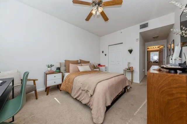 a bedroom with bed and window