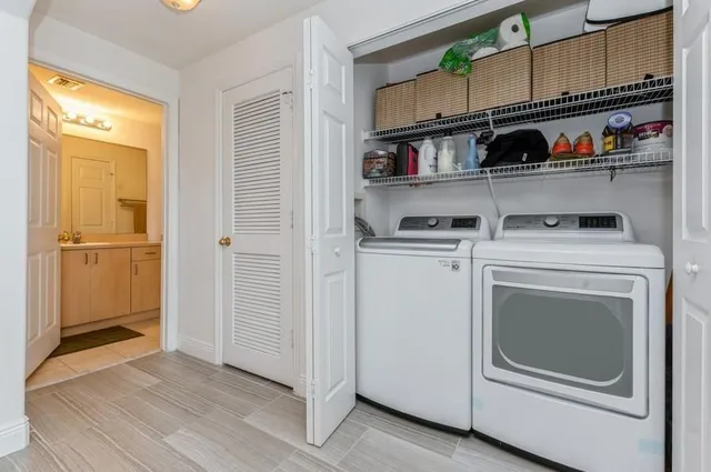 a kitchen with cabinets and wooden floor