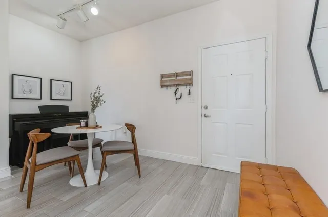 a workspace with furniture and wooden floor