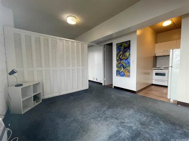 a view of an empty room with a window