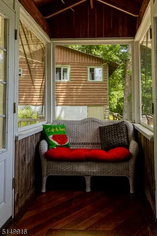 a view of a deck with a table and chairs with wooden floor