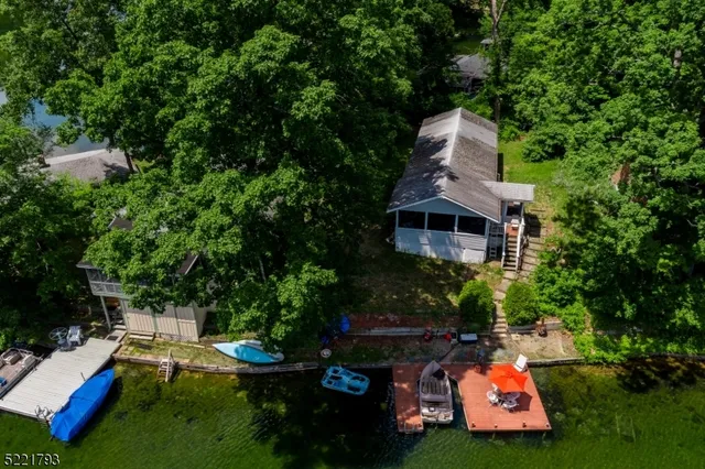 a aerial view of a house with swimming pool and garden