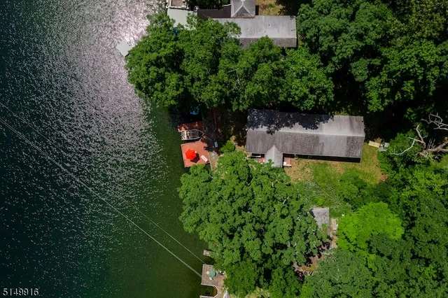view of a house with a yard and garden