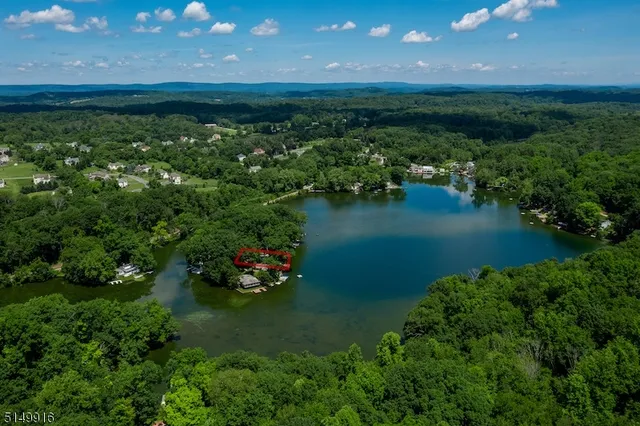 a view of a lake with a yard