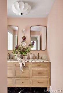 240 Eastwoods Road Pound Ridge, NY 10576 - Photo 23 of 46 a bathroom with a sink vanity and mirror