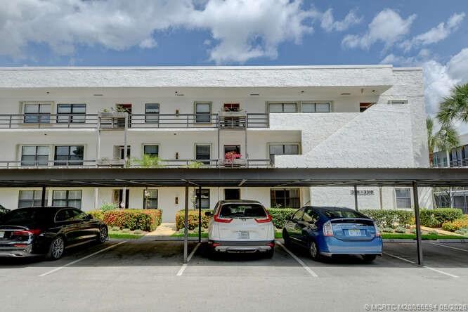 1950 Southwest Palm City Road, Unit 3209 Stuart, FL 34994 - Photo 5 of 64 Convenient covered parking.