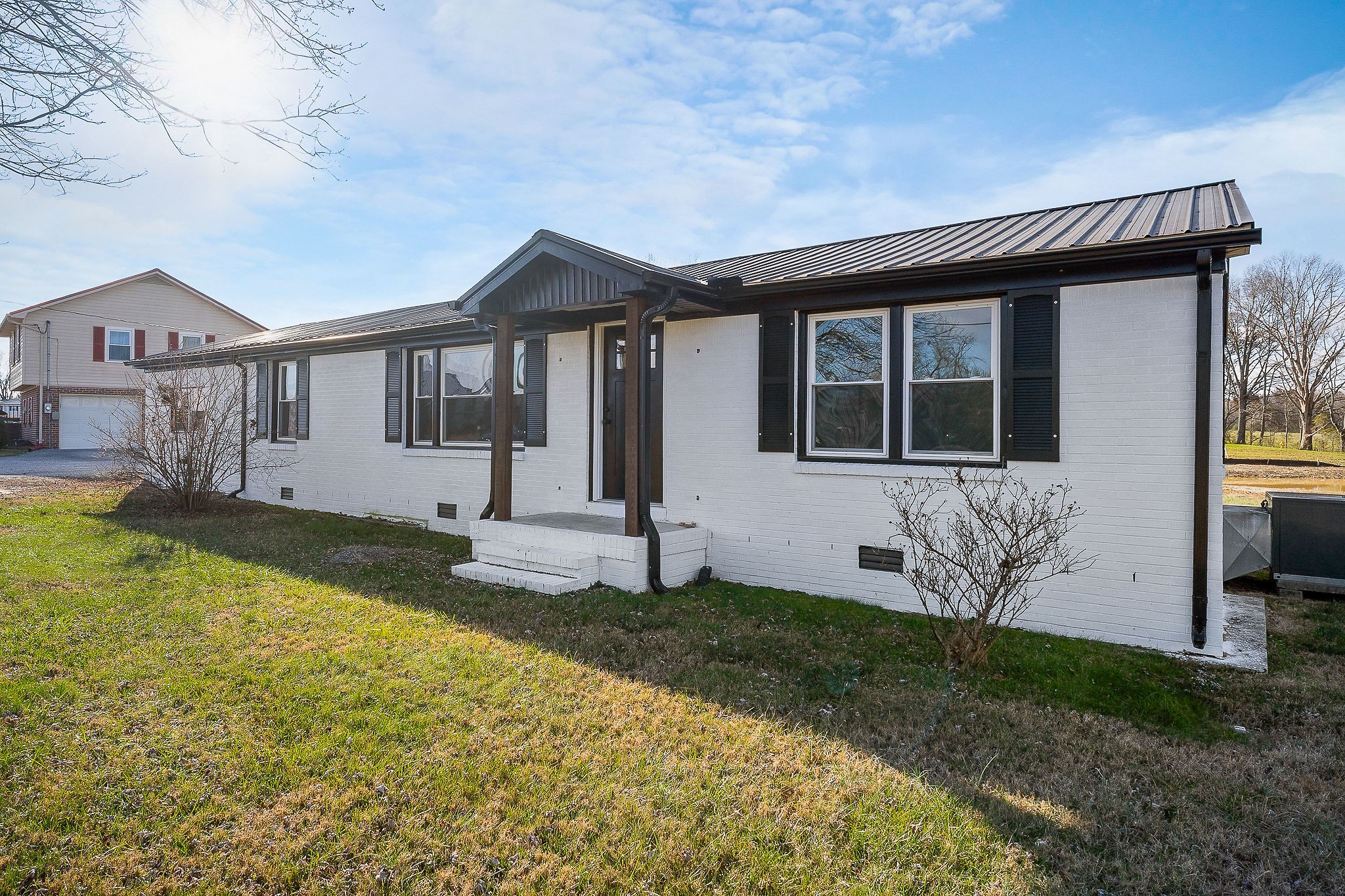 763 Smith Road Smithville, TN 37166 - Photo 25 of 29 a front view of a house with garden