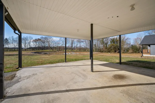 a view of a road with yard