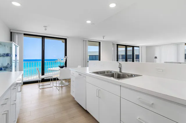 a living room with granite countertop furniture a fireplace and a large window