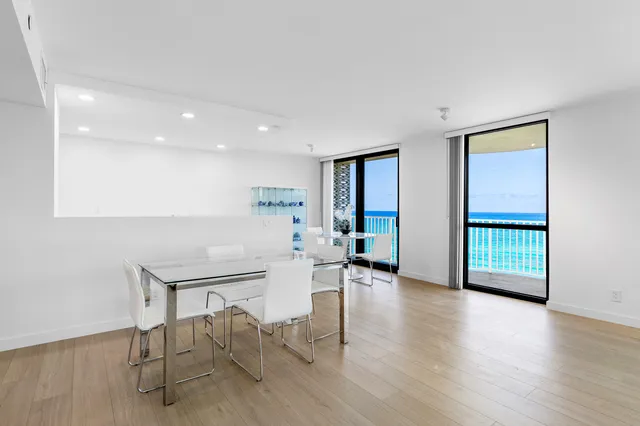 a view of a livingroom with furniture and a window