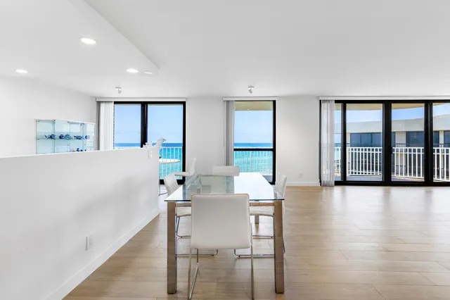 a view of a dining room with furniture and window