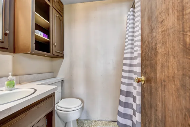 a bathroom with a toilet and a sink