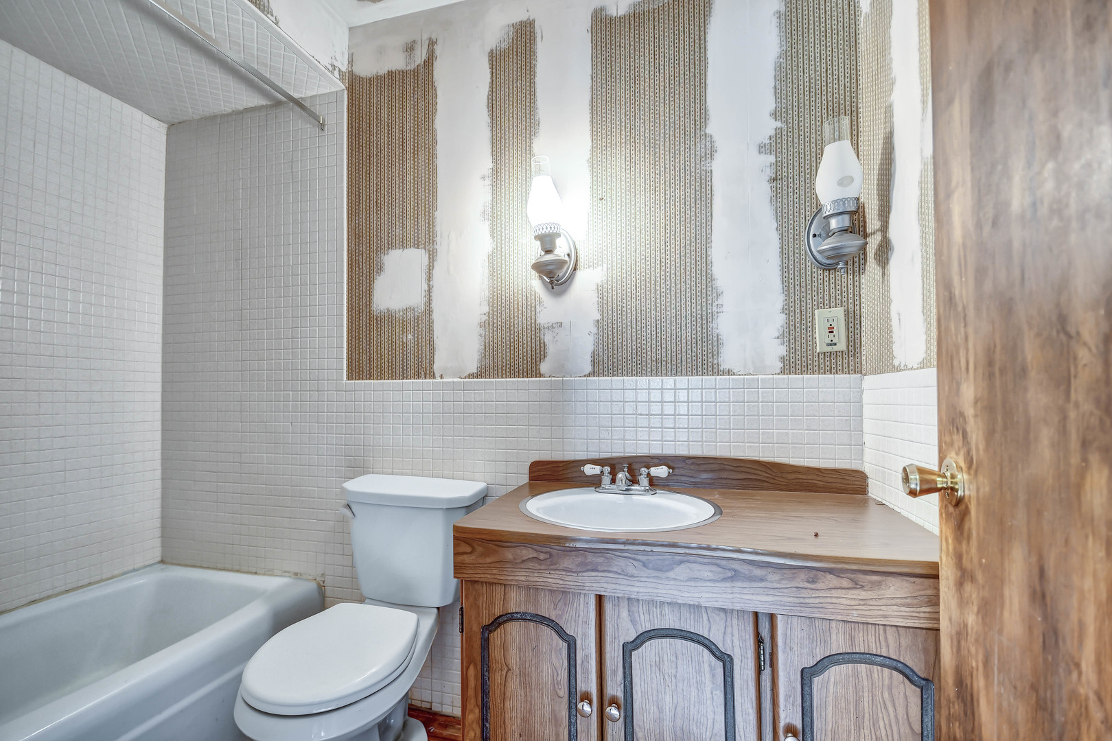 1000 Oneida Street Joliet, IL 60435 - Photo 15 of 21 a bathroom with a granite countertop toilet a sink and a mirror