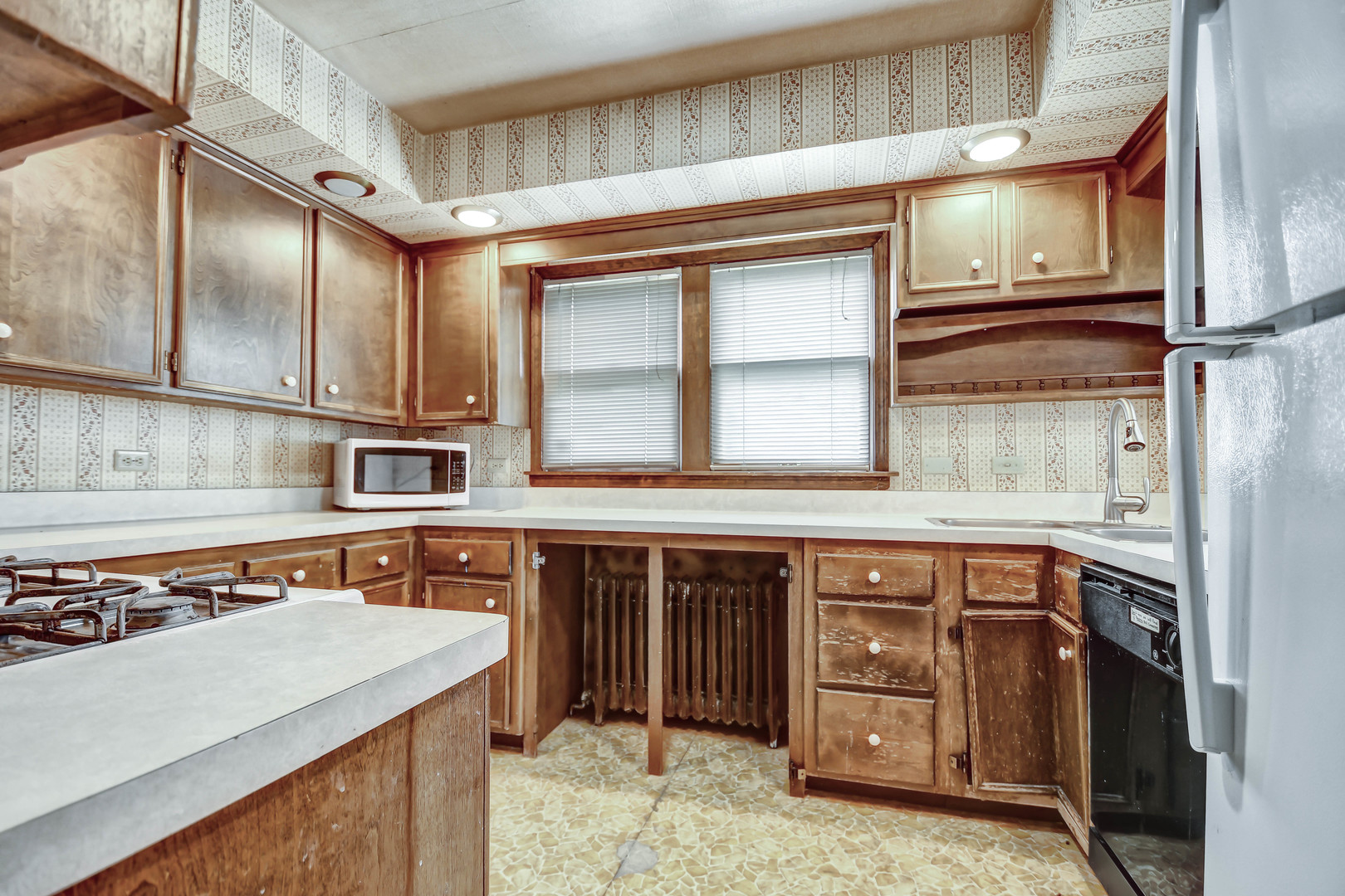 1000 Oneida Street Joliet, IL 60435 - Photo 8 of 21 a kitchen with stainless steel appliances granite countertop a sink and a stove