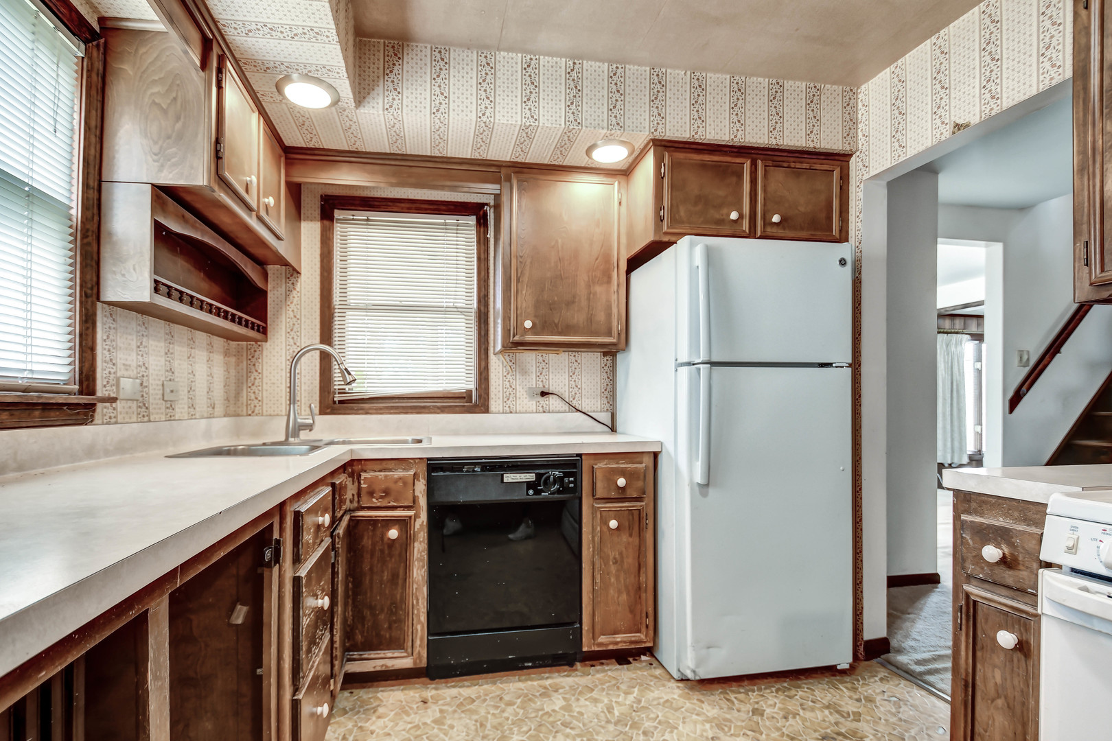 1000 Oneida Street Joliet, IL 60435 - Photo 9 of 21 a kitchen with stainless steel appliances granite countertop a refrigerator a sink and a stove