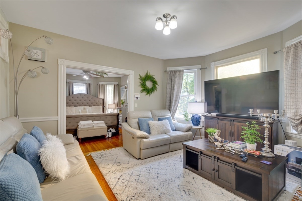 69 Milton Street Dedham, MA 02026 - Photo 10 of 33 a living room with furniture and a flat screen tv