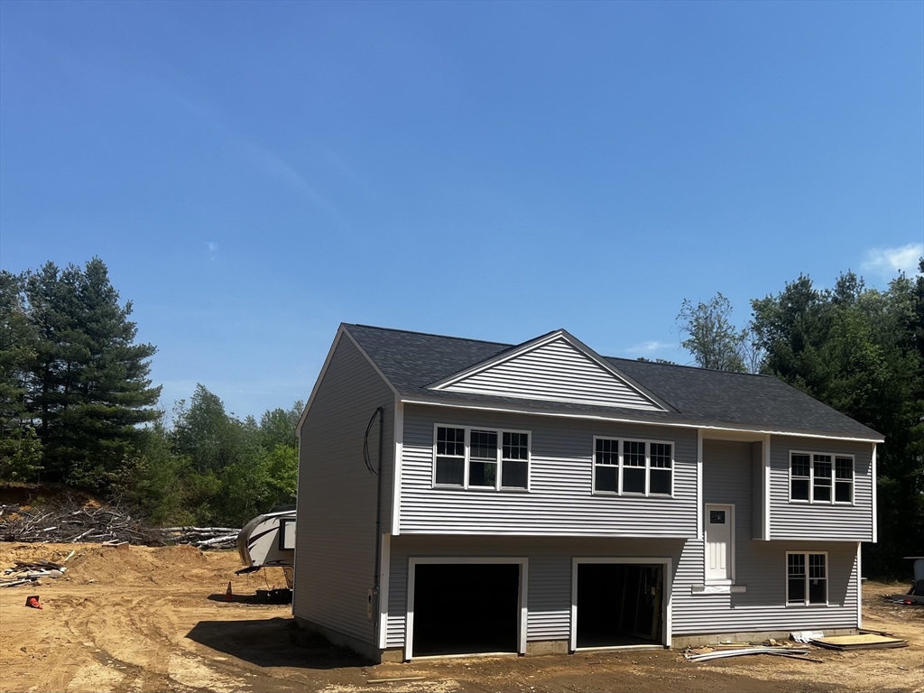 940 Old West Brookfield Road Warren, MA 01083 - Photo 2 of 4 a front view of a house with a yard