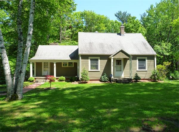 408 Florence Road Northampton, MA 01062 - Photo 1 of 30 a backyard of a house with table and chairs and a large tree