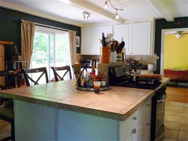 408 Florence Road Northampton, MA 01062 - Photo 11 of 30 a room with wooden floor a table and a large window
