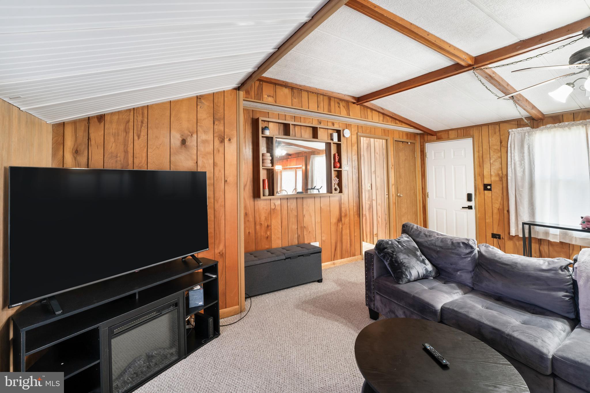 417 Captain Smith Lane Buena, NJ 08310 - Photo 12 of 31 a living room with furniture and a flat screen tv