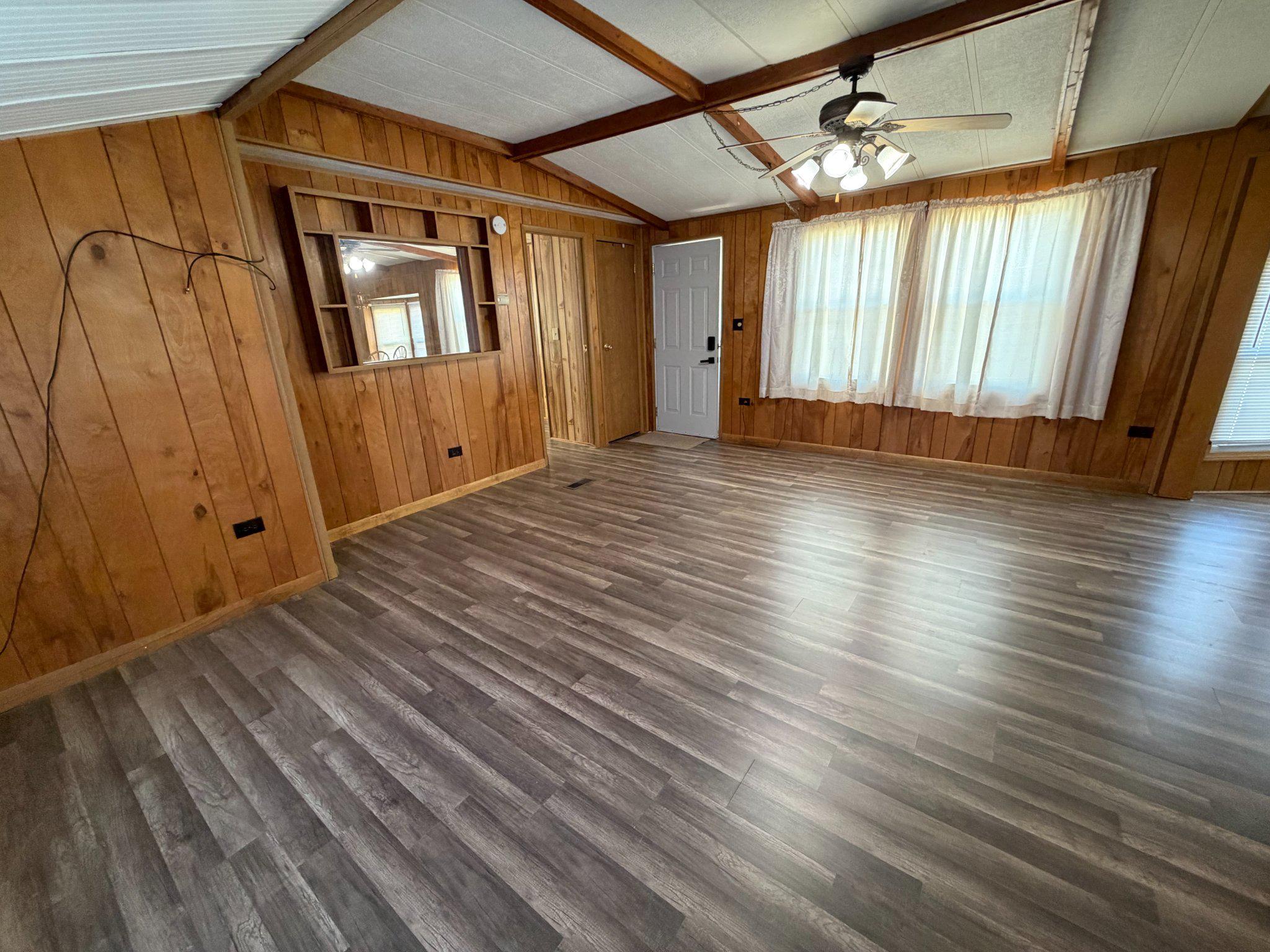 417 Captain Smith Lane Buena, NJ 08310 - Photo 19 of 25 an empty room with wooden floor and windows