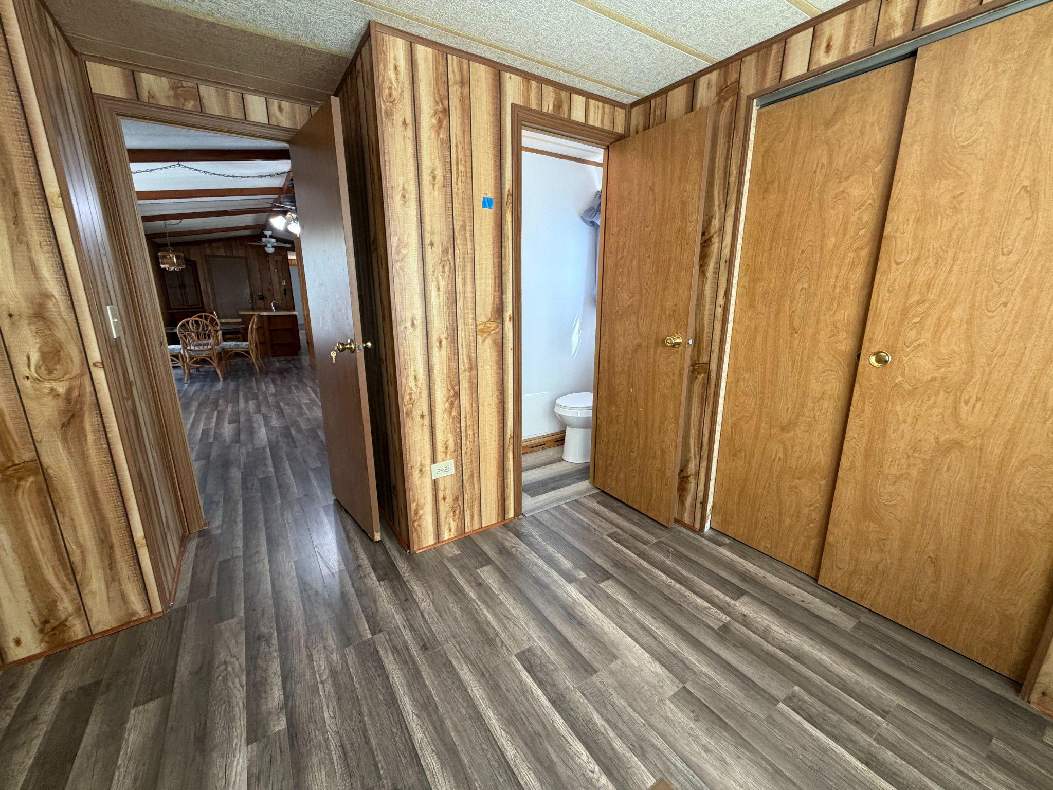 417 Captain Smith Lane Buena, NJ 08310 - Photo 21 of 25 a view of a hallway with wooden floor and staircase