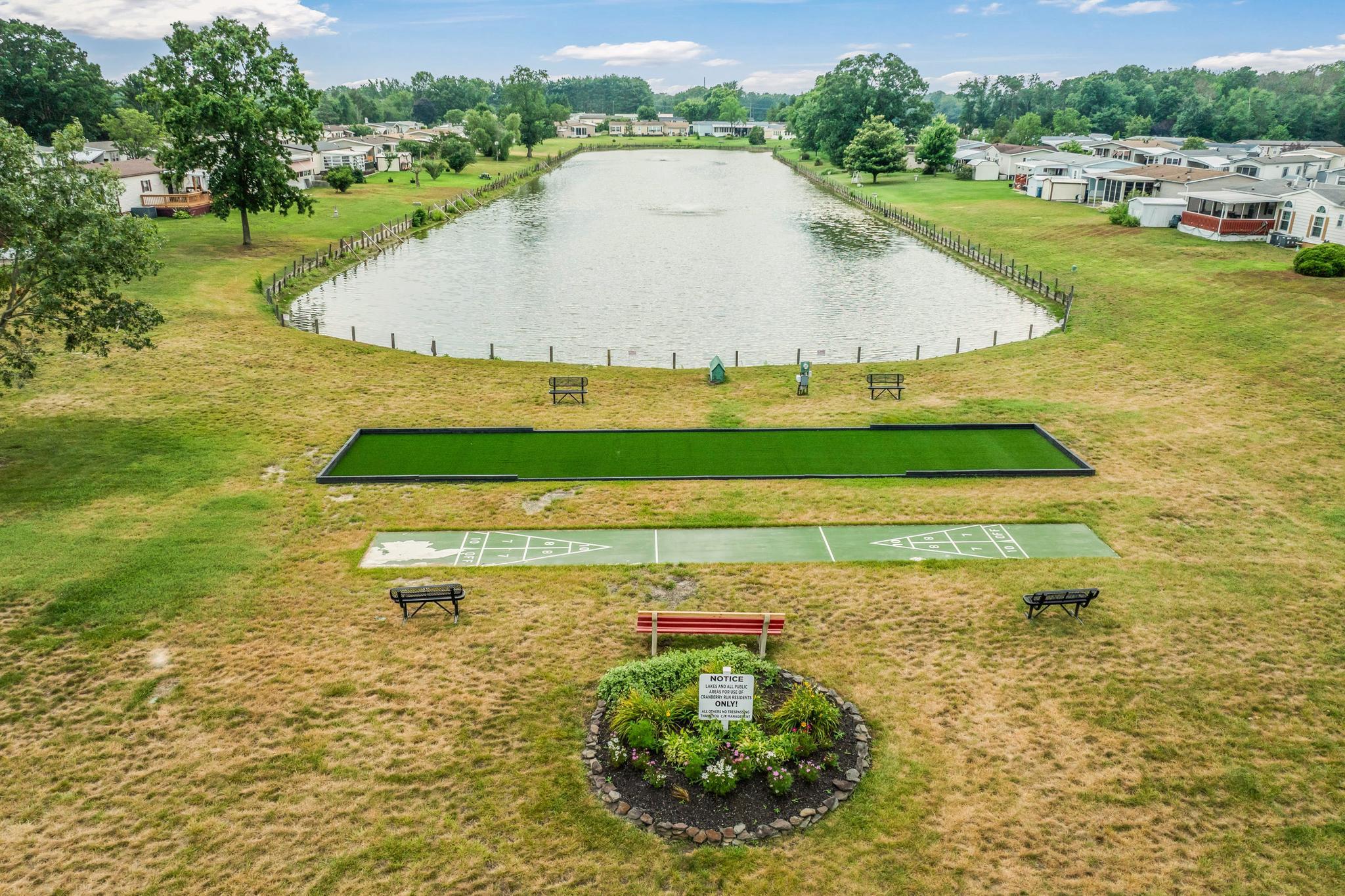 417 Captain Smith Lane Buena, NJ 08310 - Photo 25 of 25 a view of a swimming pool with a yard and plants