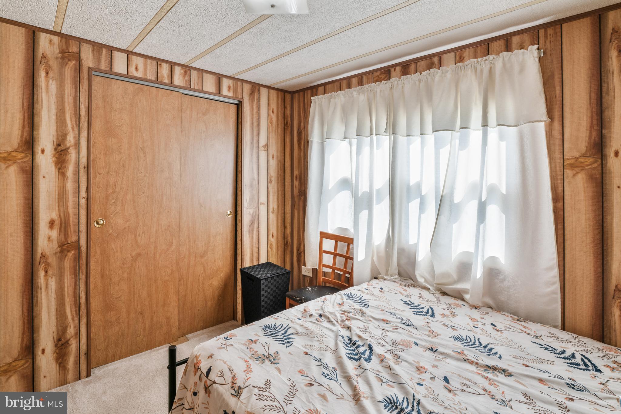 417 Captain Smith Lane Buena, NJ 08310 - Photo 28 of 31 a bedroom with a bed and a window