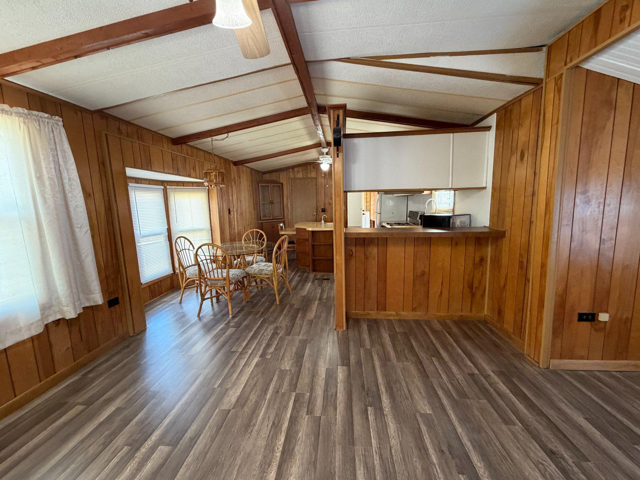 417 Captain Smith Lane Buena, NJ 08310 - Photo 9 of 25 a furnished livingroom with windows and wooden floor